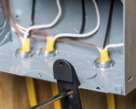 can a wire clamp be inside the electrical box|electrical panel knockout clamp.